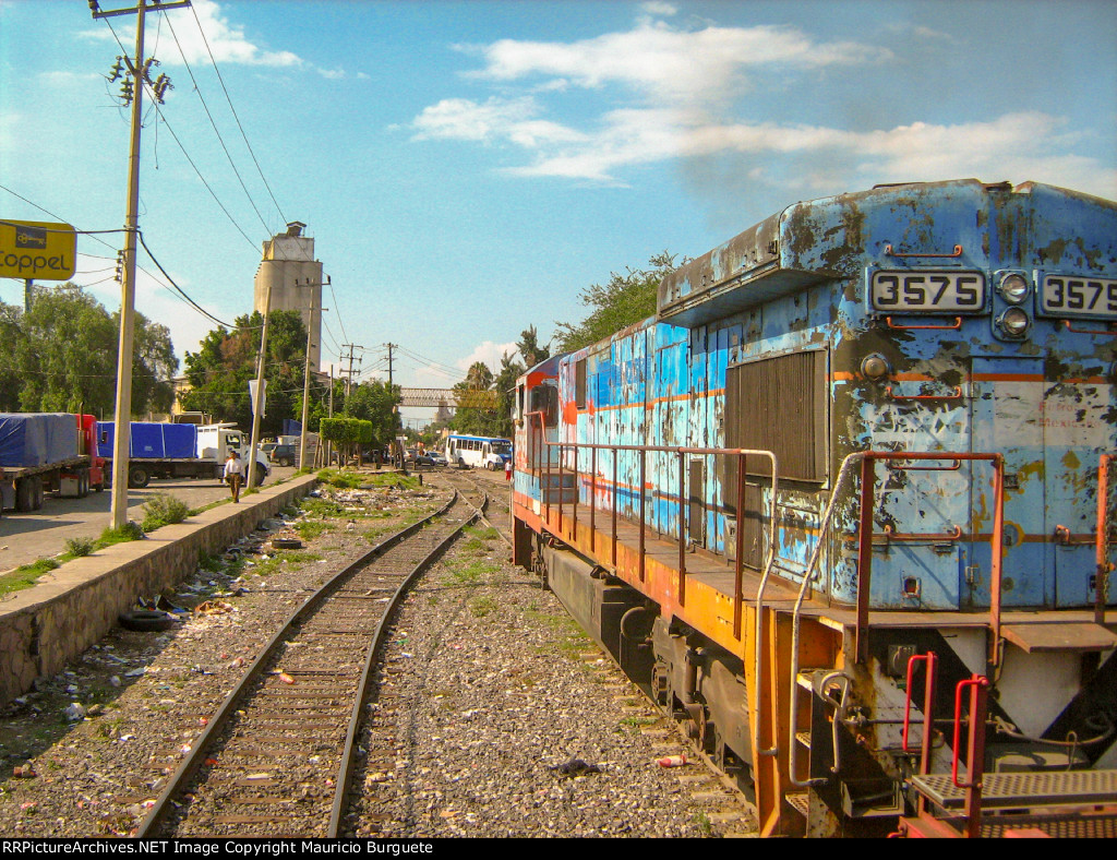 FXE C30-7 Locomotive in the yard with faded paint scheme